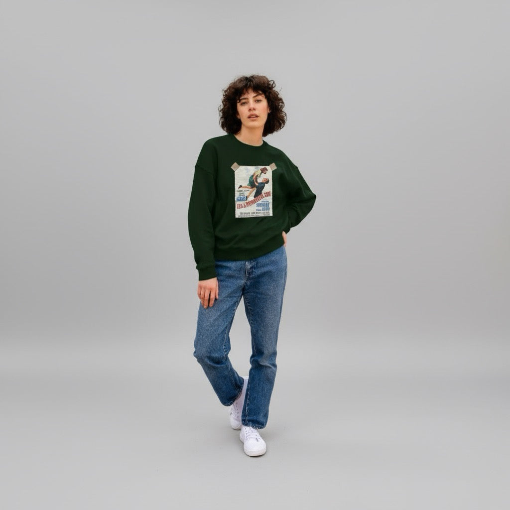 Person wearing a green sweatshirt with a graphic design