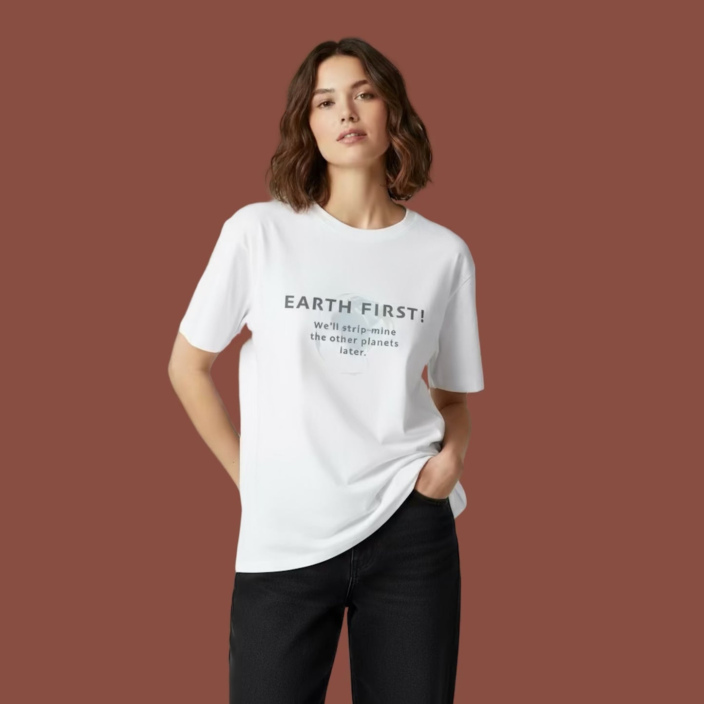 Female model wearing a white t-shirt with 'Earth First!' text