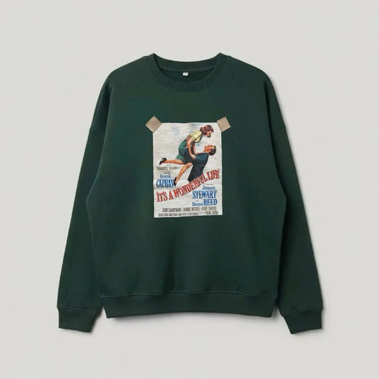 Green sweatshirt with a graphic design on a gray background