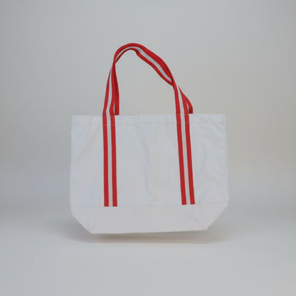 White tote bag with red stripes on a light gray background