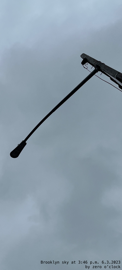 a street lamp underneath the sky