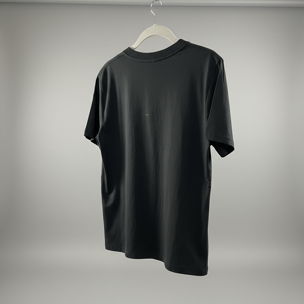 Black t-shirt on a hanger against a gray background