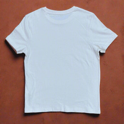White t-shirt on a brown surface