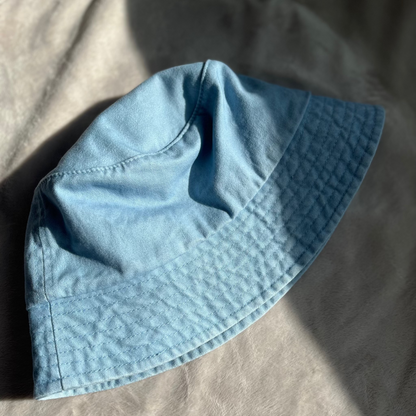 washed blue bucket hat flat lay product photo
