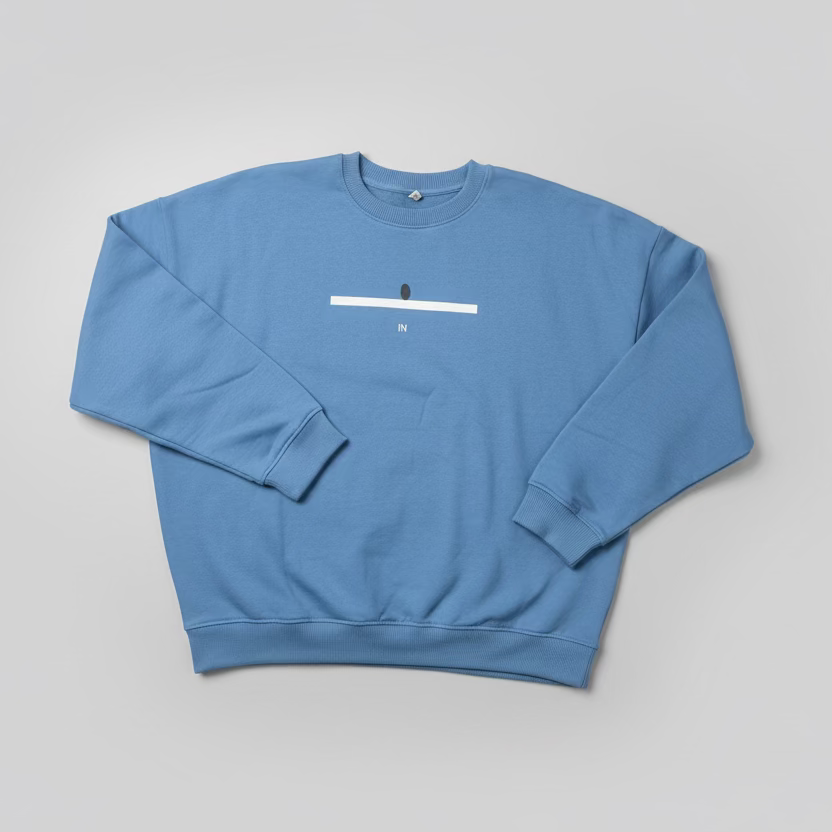Blue sweatshirt with a line and a tennis ball mark on the chest