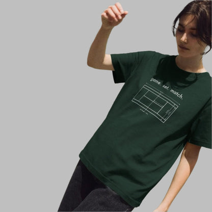 Person wearing a green t-shirt with a tennis court design and text
